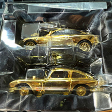 Corgi 40th Anniversary Twin Set James Bond Aston Martin Gold Cars w/ Stand
