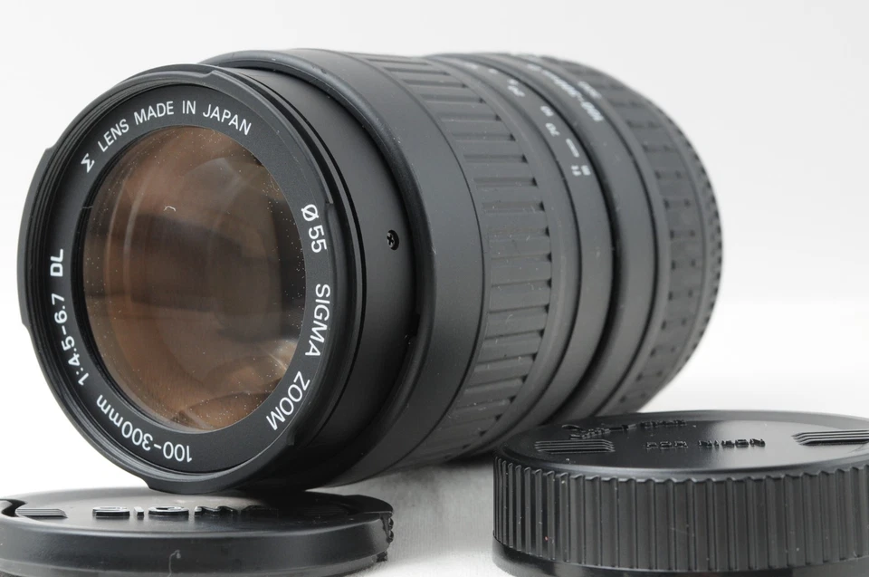 [PRESQUE COMME NEUF] Objectif zoom SIGMA 100-300 mm f/4,5-6,7 DL AF pour mont... - Photo 1/4