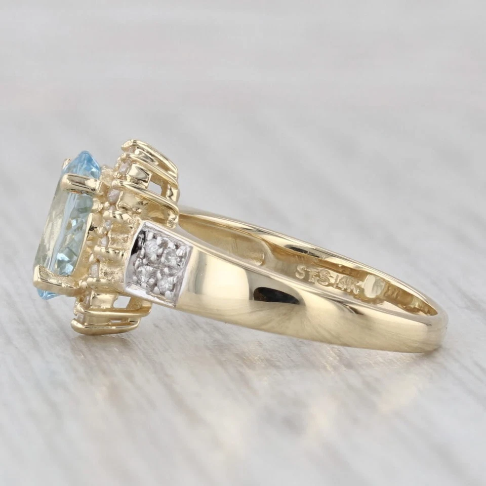 Anillo con halo de diamantes aguamarina ovalado de 1,69 quilates de oro amarillo de 14 k talla 6 Foto 3 de 4
