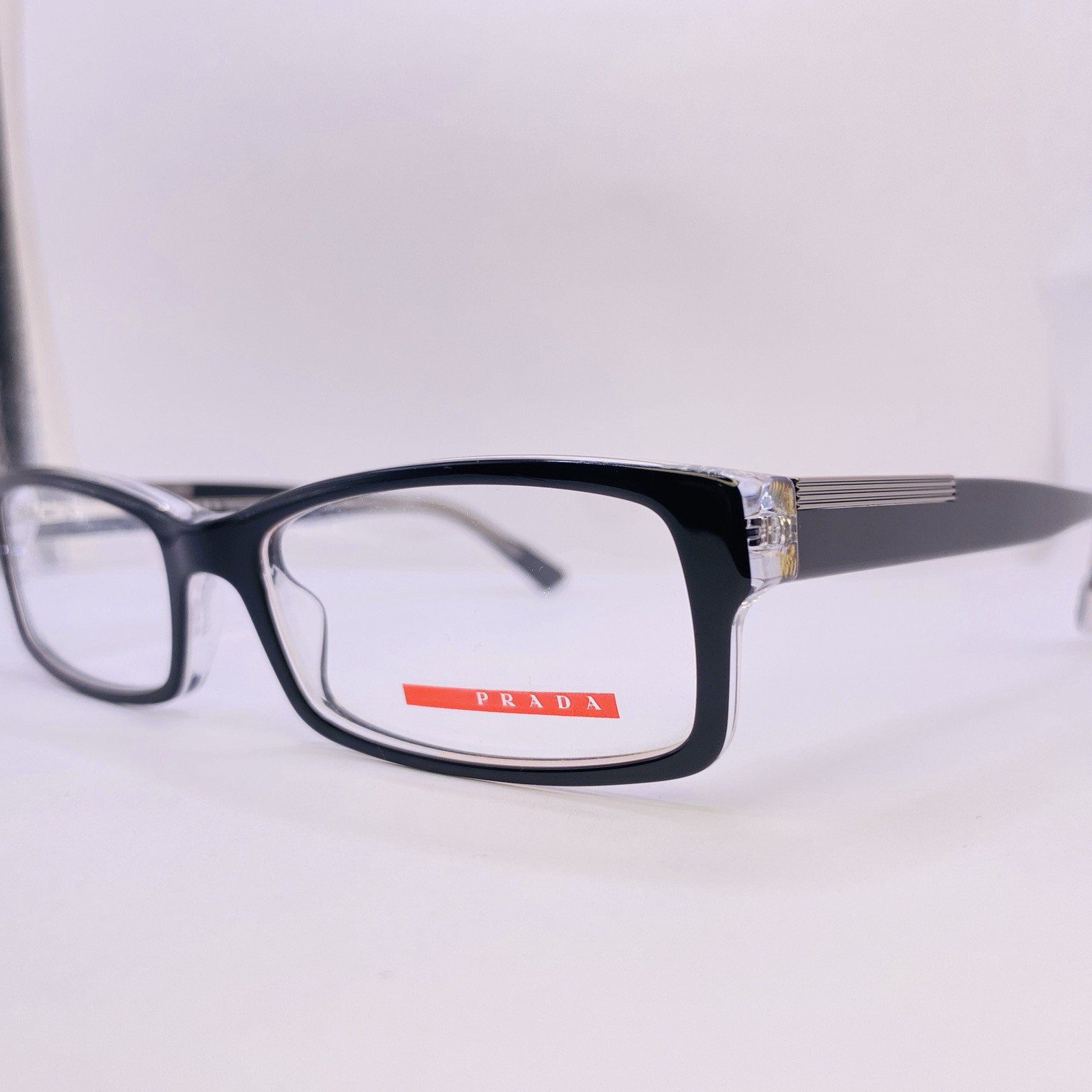 Prada VPR 10A 2AF-1O1 Sunglasses 54mm Transparent Black Red Frame