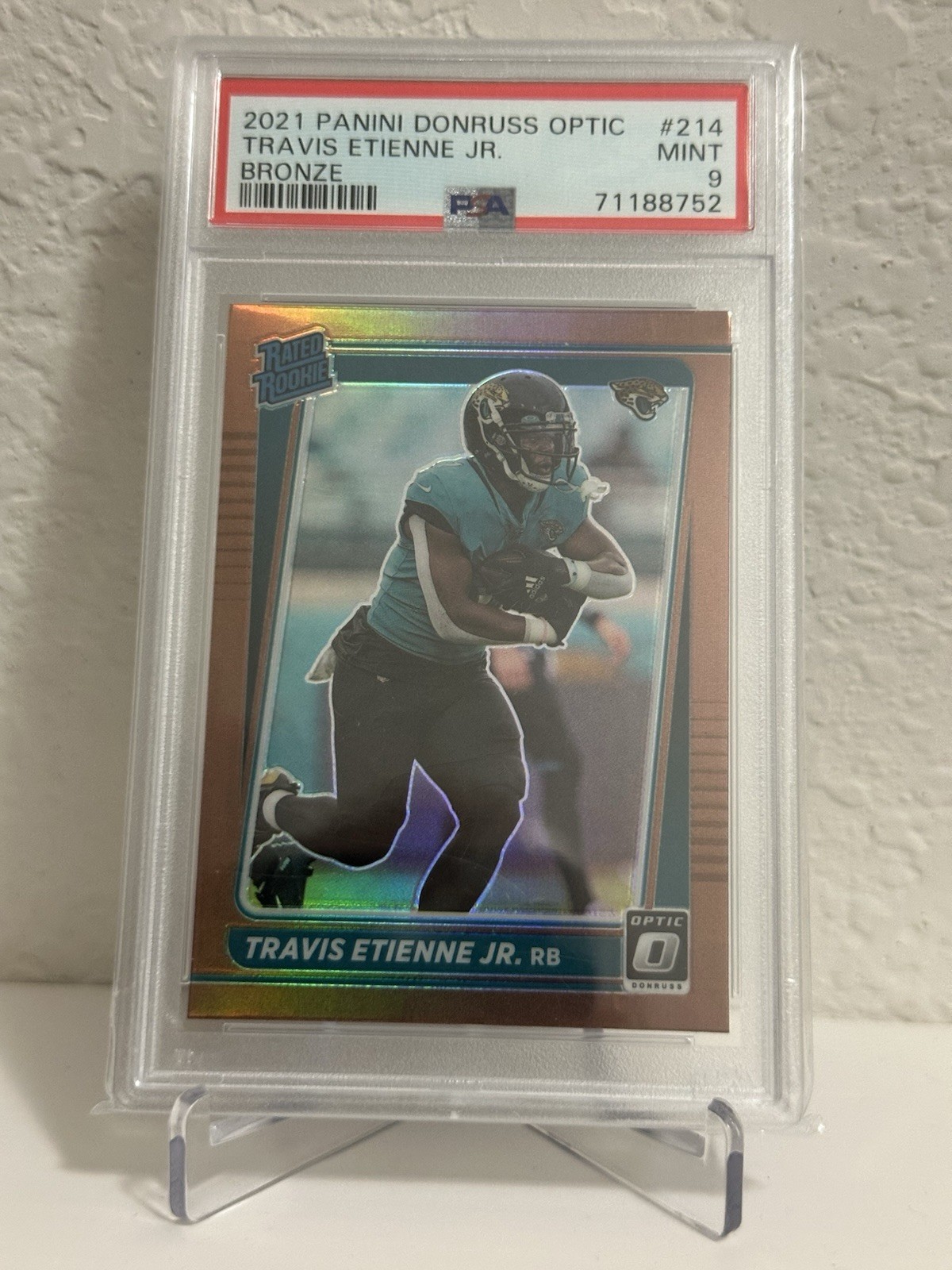 2021 Panini Donruss Optic Rated Rookie Travis Etienne #214 bronze (PSA 9)