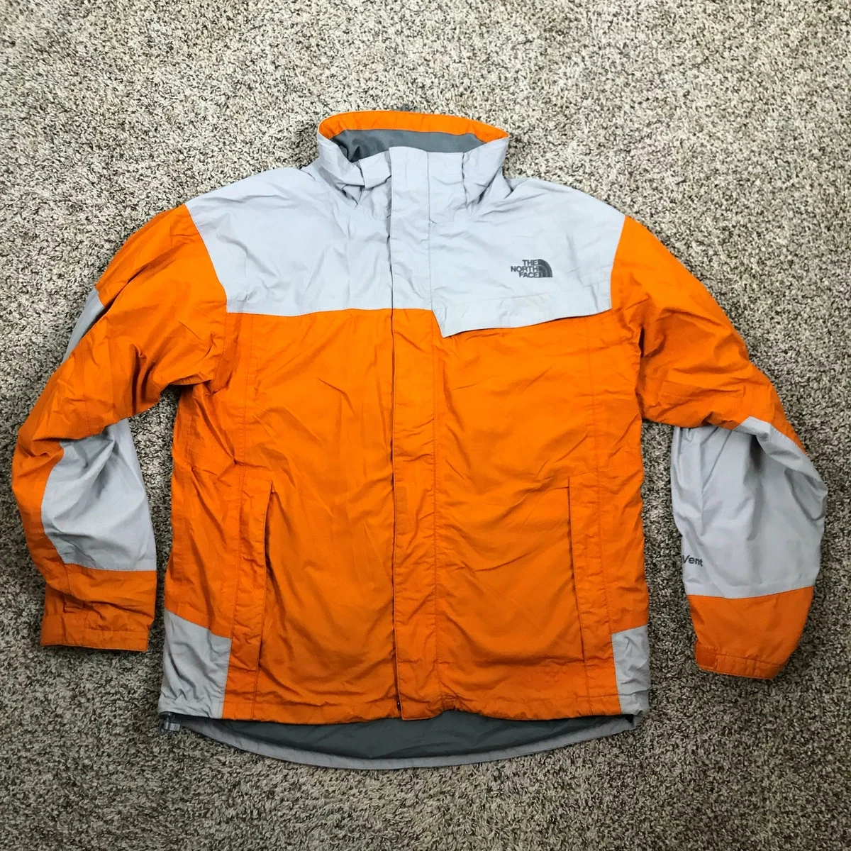 The north shop face orange coat