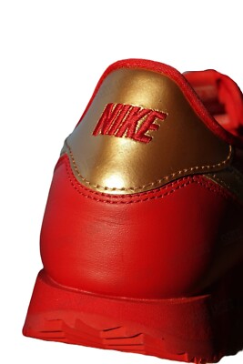 red nike with gold swoosh