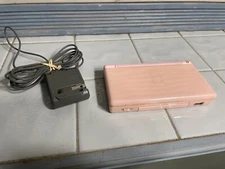 Pink Nintendo DS lite with charger