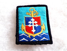 Un insigne tissu militaire " 9° Division d'Infanterie de Marine ".