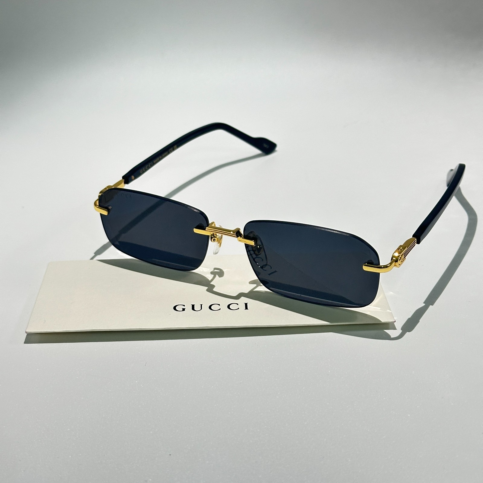 Gucci GG1221S 001 Black Gold Rimless Sunglasses Gray Lens 56mm