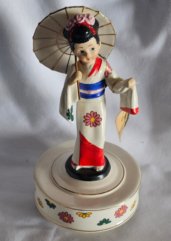 A genuine Schmid Japan musical figurine playing 'Sukiyaki' — a charming mid-century Japanese export collectible with real cultural nostalgia.
