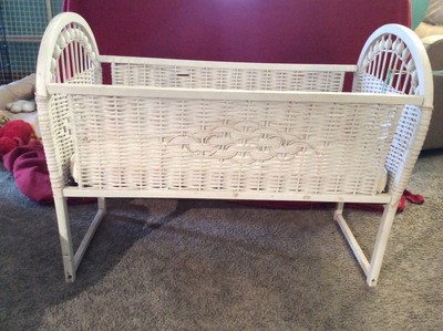 white wicker bassinet
