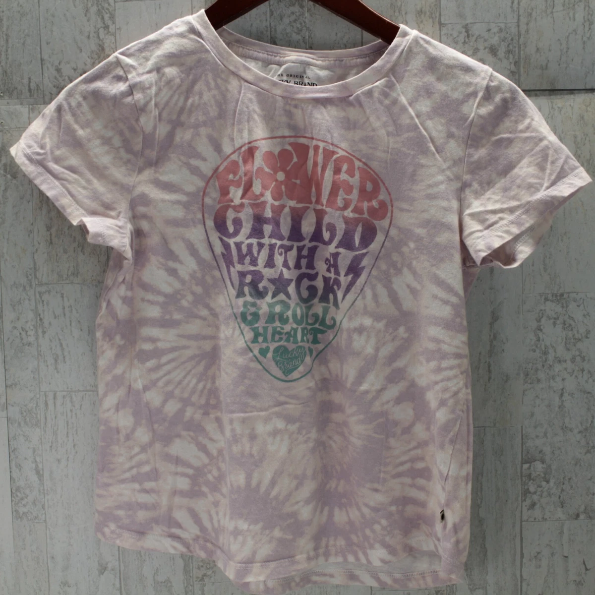 flower child with a rock and roll heart shirt