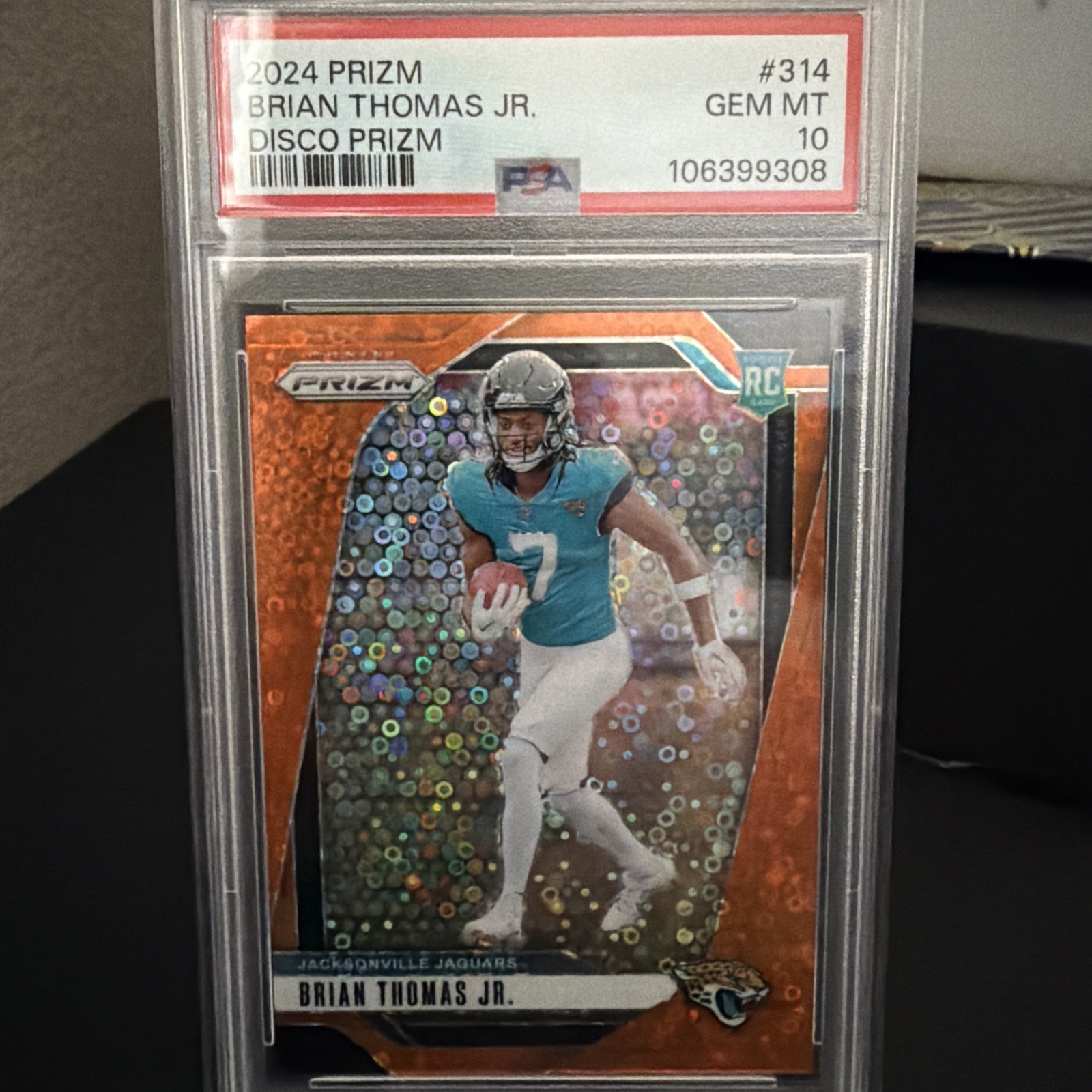 2024 Prizm Brian Thomas Jr. RC Orange Disco Rookie #314 Jaguars PSA 10