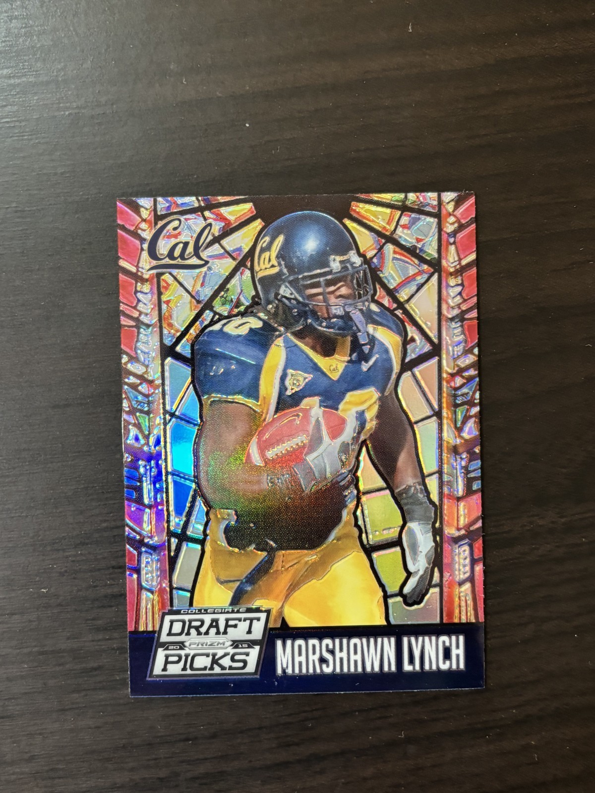 Marshawn Lynch [Stained Glass} #33 Football Cards 2015 Panini Prizm Collegiate Draft Picks trading card — raw and PSA graded price guide