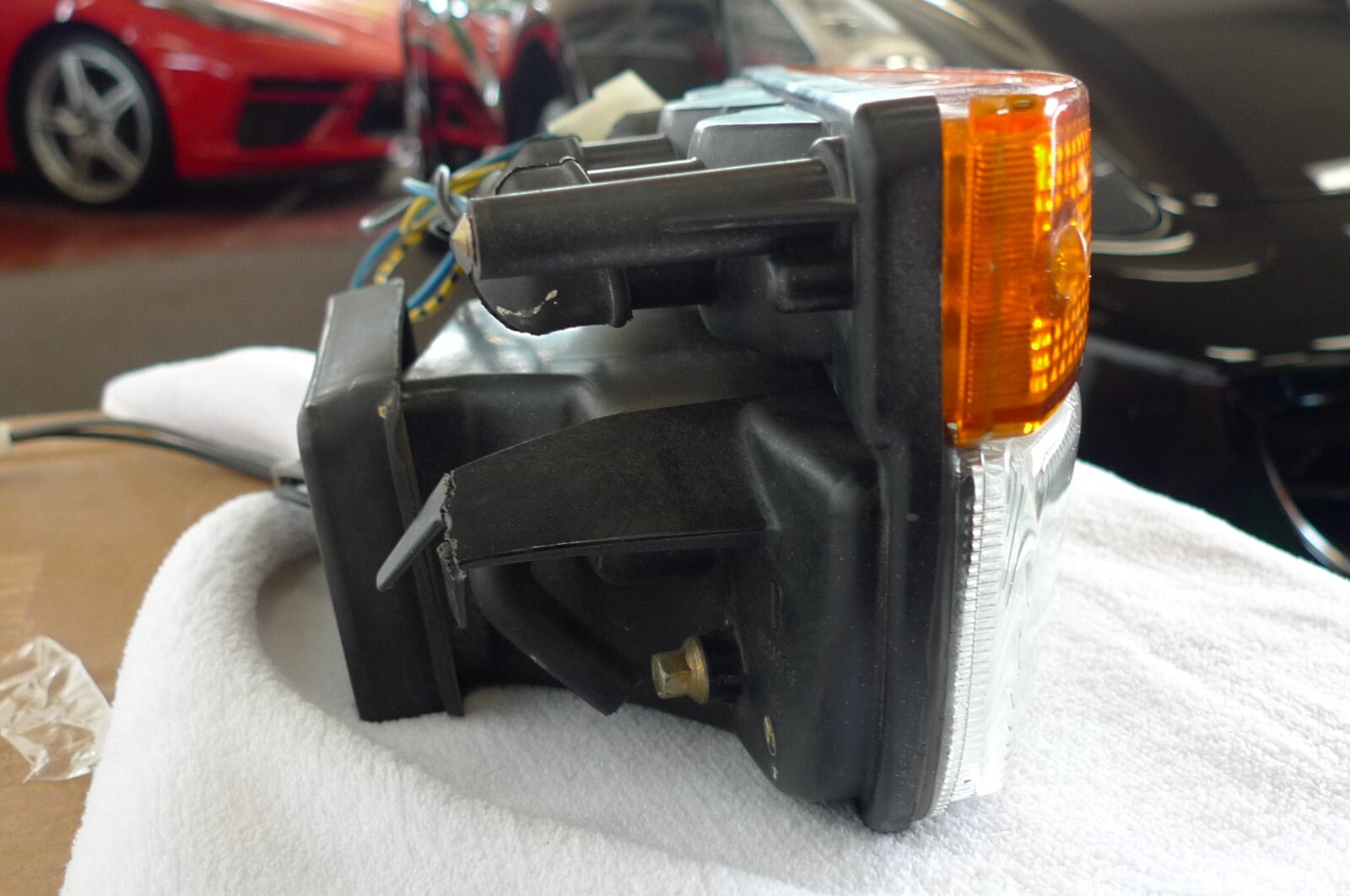 Ferrari 328 front right parking lamp assembly made by Carello part # 11.260.748