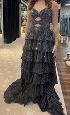 Sherri Hill 57416.Strapless A-line gown with keyholes, ruffle skirt with slit.