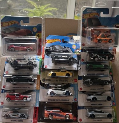 Hot Wheels Konvolut PKW 1:64 94/250 Blister Ferrari Supra Tesla 3-4 Jahre
