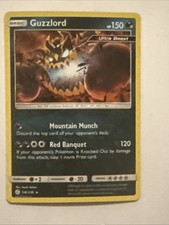 Guzzlord 136/236 Sm-Cosmic Eclipse Holo