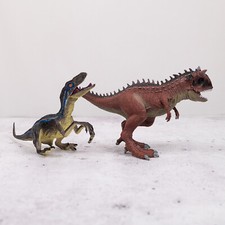 Schleich Carnotaurus; off-brand Velociraptor dinosaurs 2-piece set 