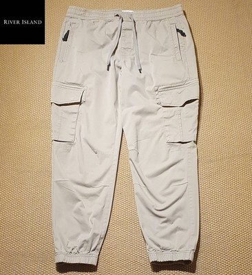 River Island Herren Cargohose mit Bündchen Knöchellang Gr. 32S W32 L27 Hellkhaki