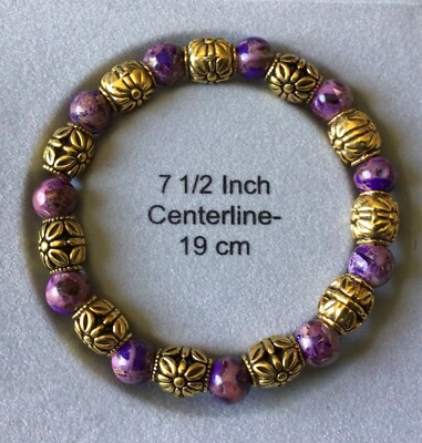 7.5'' bracelet w/multi shades of purple & gold hues. made in the USA