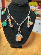 Charm necklace with rose pendant