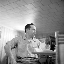 US professional baseball player cultural icon Yogi Berra sits at a- Old Photo