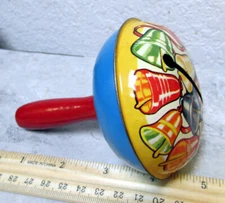 Vintage T Cohn tin noise maker collectible, festive bells graphics, wood handle