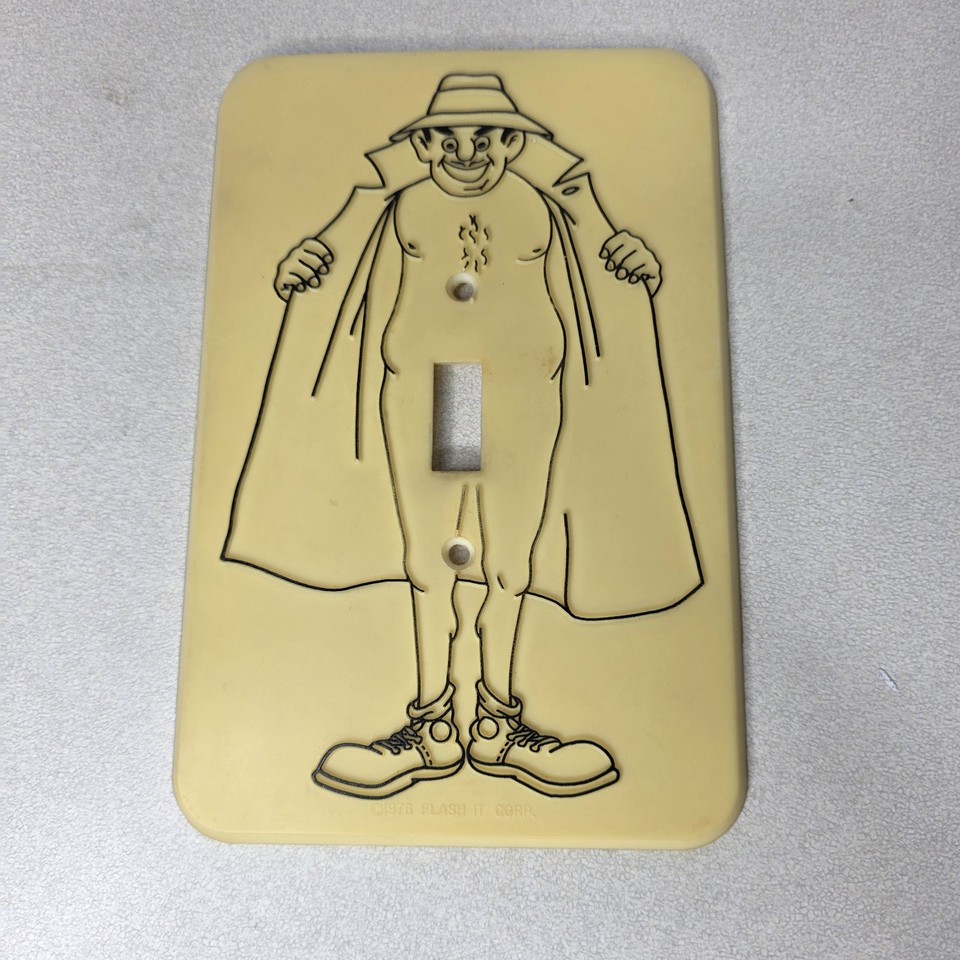 A genuine 1976 Flash It Corp novelty switchplate that makes your boring light switch flash — wonderfully absurd 70s décor artifact.