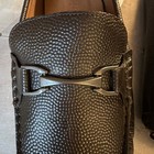 Dark brown textured leather Allen Edmonds men’s loafers with silver H-bit buckle and size 13D label made in USA.