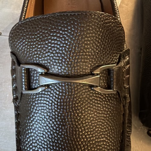 Dark brown textured leather Allen Edmonds men’s loafers with silver H-bit buckle and size 13D label made in USA.