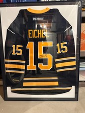 Signed and Framed Jack Eichel Jersey