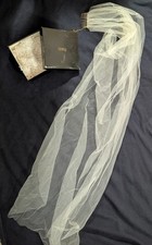 Wedding veil with comb. Simple and eloquent and never used.