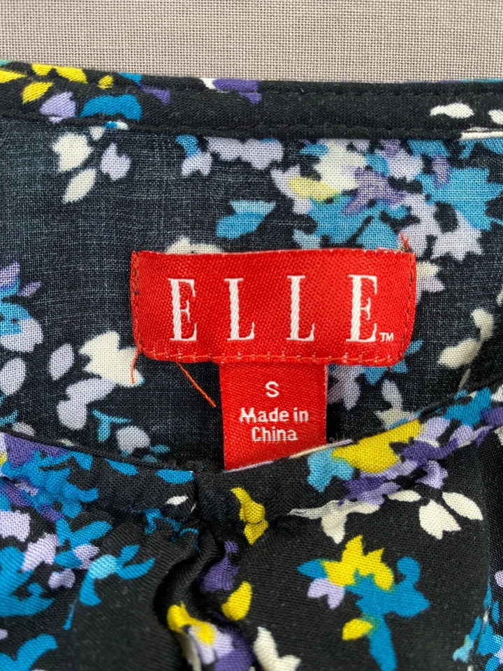 Camiseta sin mangas azul con volantes florales y bolsillos Elle para mujer sin mangas cuello en V talla pequeña Foto 4 de 4