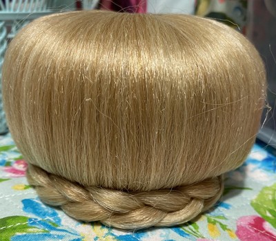 Blonde clip on bun with braid