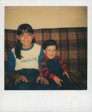 Old Vintage Photo COLOR POLAROID BOY GIRL DUO SITTING ON COUCH LIVING ROOM