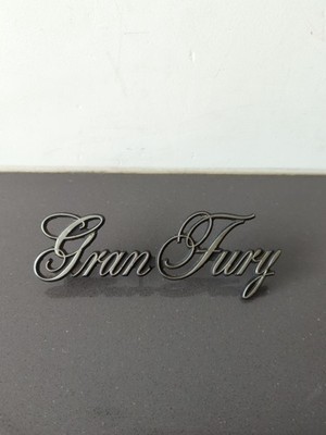 Used OEM Mopar Script Emblem 3811505 1975-1977 Plymouth Gran Fury (293) M40
