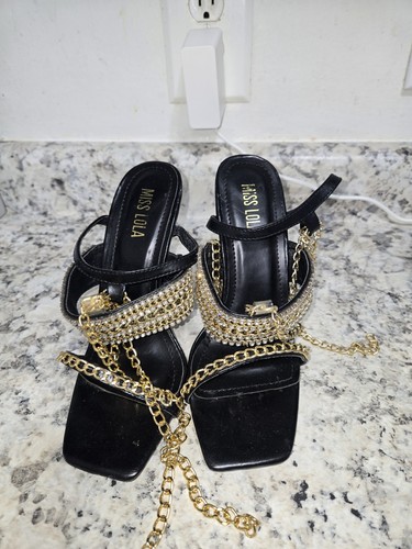 Miss Lola heels  distinctive gold chain ankle strap and a square toe design