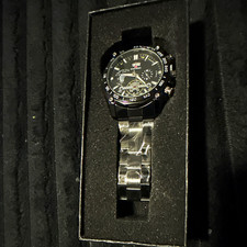 UMT Men's Quartz Watch Black Dial Tachymeter Bezel Day/Date Steel Bracelet