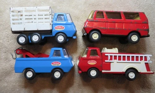 4 Vintage metal tonka trucks.