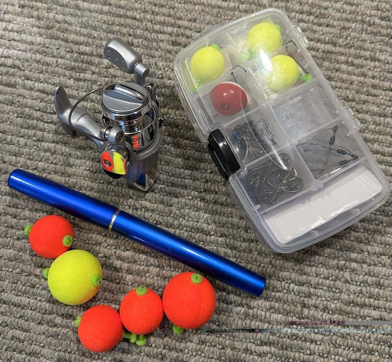 compact, lightweight fishing pole, reel and some tackle 