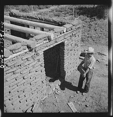 Photo:Southwest Adobe Brick Building Construction 1930s Man Entrance