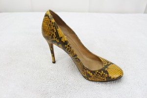 yellow and black pumps