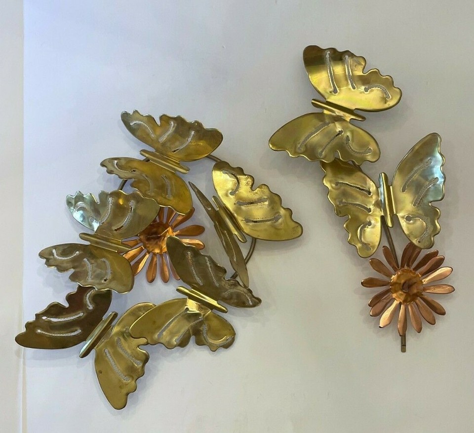 A two-piece brass & copper butterfly and daisy wall art set — delicate, genuinely vintage metalwork that hits that sweet spot between groovy 70s craft and timeless botanical art.