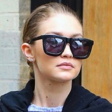 Karen Walker Bold Black Woman Sunglasse Sleek and modern design.