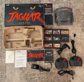 Boxed Atari Jaguar Console with 8 Games, spare controller and instructions.