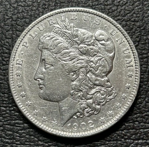 1902-P Better Date MORGAN SILVER DOLLAR. Our Opinion is AU.