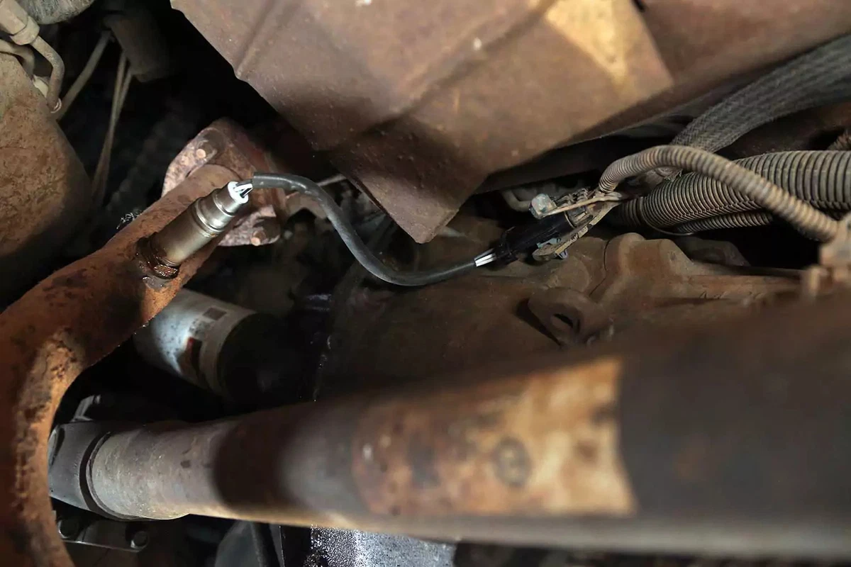 The new oxygen sensor wiring secured in position, avoiding any moving mechanical parts or hot exhaust components.