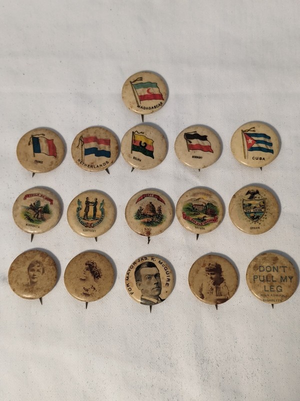 16 Tobacco Celluloid Pins (VG condition)