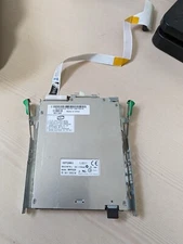 Various slim 1.44 3.25 floppy drives with ribbon cables and bracket No faceplate