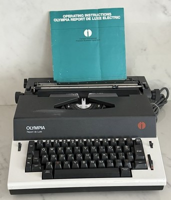 Olympia Report De Luxe Typewriter with manual , Untested.