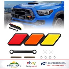 Stylish Front Grille Emblem In Yelloworangered For Vehicle Customization Stylish Front Grille Emblem In Yelloworangered For Vehicle Customization