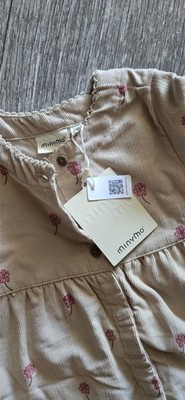 Minymo beige corduroy dress with a pink floral print.
